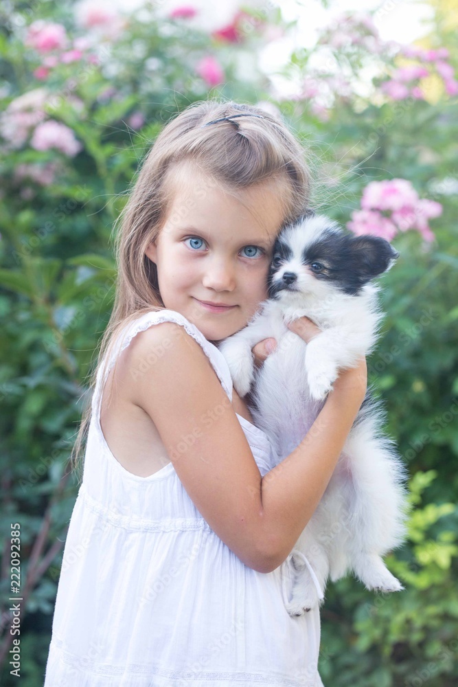 Portrait of a girl with a puppy Portrait of a girl with a puppy
