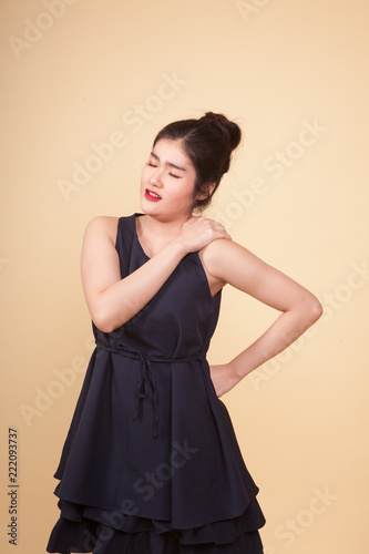 Young Asian woman got back pain.