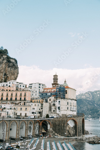 The Amalfi coast and the mountain slopes with plantations of lemons. Panoramic view of the city and nature of Italy. Evening landscapes and winding roads photo