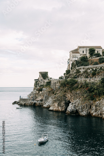 The Amalfi coast and the mountain slopes with plantations of lemons. Panoramic view of the city and nature of Italy. Evening landscapes and winding roads