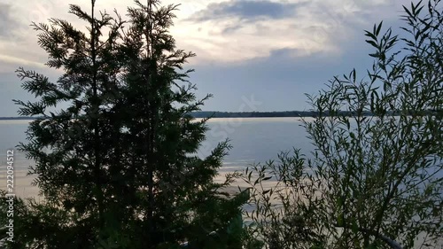 Looking out at the calm water of Lake Scugog in the evening photo