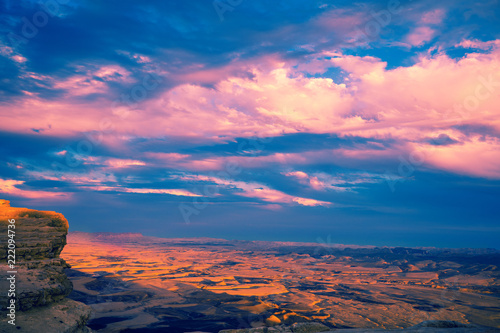 Beautiful dramatic sunset over the desert. Mitspe Ramon crater, Israel