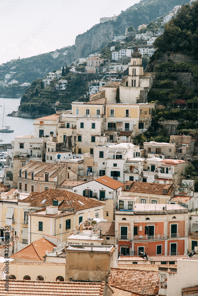 Obraz premium Amalfi coast in Italy, the most beautiful city. Streets and old architecture, narrow passages, shops and cafes. View from the sea and above