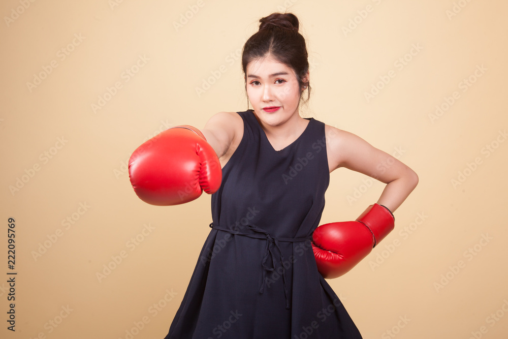 Young Asian woman with red boxing gloves. Young Asian woman with red boxing gloves.