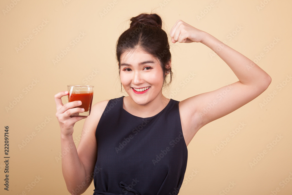 Asian woman with tomato juice and measuring tape. Asian woman with tomato juice and measuring tape.