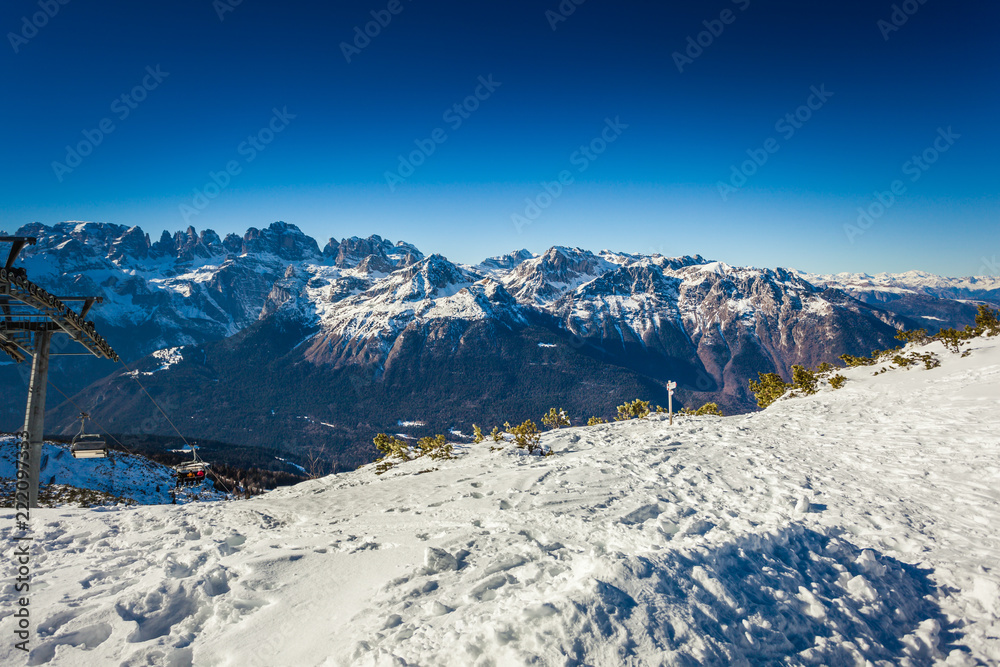 Alpine mountain range view with ski lift