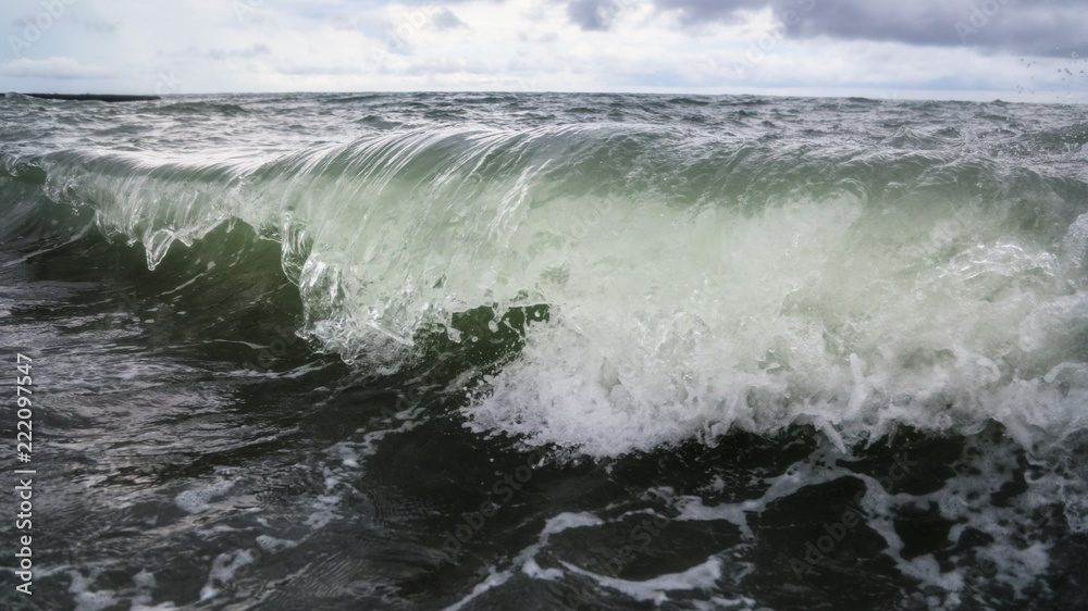 Fototapeta premium Storm waves on the seashore as a background