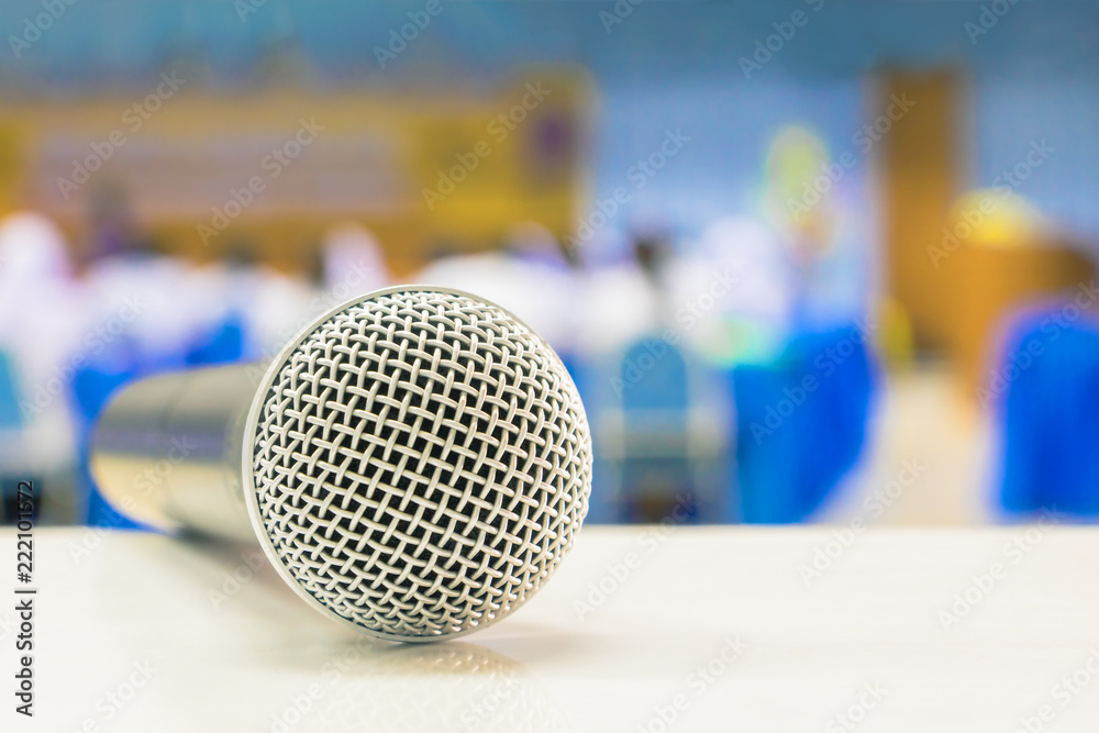 Close up microphone wireless on the white table in business conference interior seminar meeting room and Background blur Close up microphone wireless on the white table in business conference interior seminar meeting room and Background blur