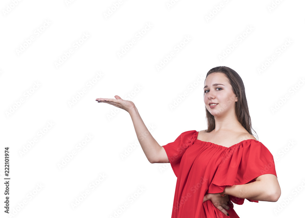 Beautiful young woman in a red dress advertises by putting an open palm to the side, isolated on a white background Beautiful young woman in a red dress advertises by putting an open palm to the side, isolated on a white background