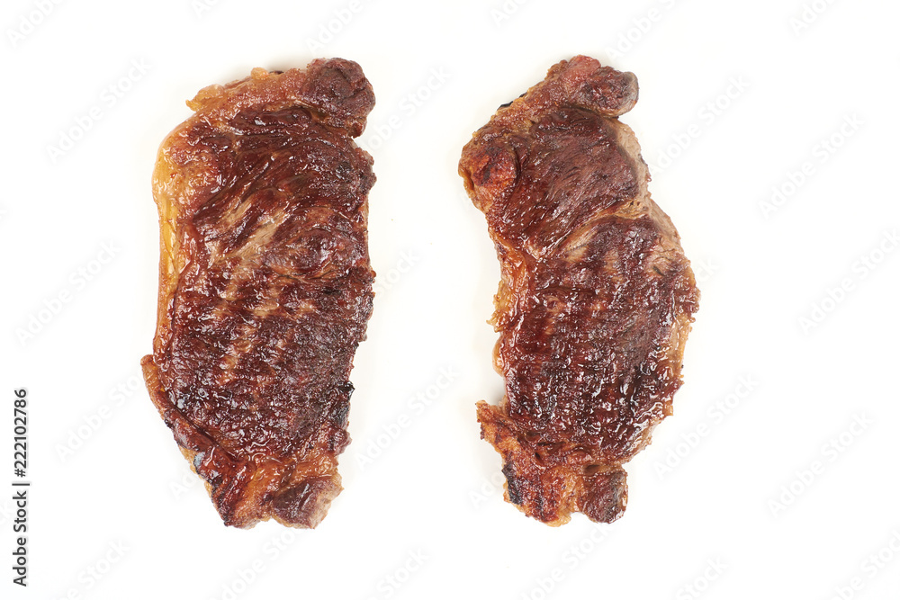 Grilled beef steak isolated over white background. Grilled beef steak isolated over white background.