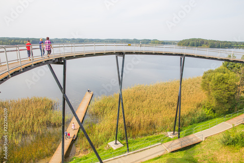 Urban city and peoples. Iron bridge on the lake. Green nature and city park. Travel photo 2018. photo