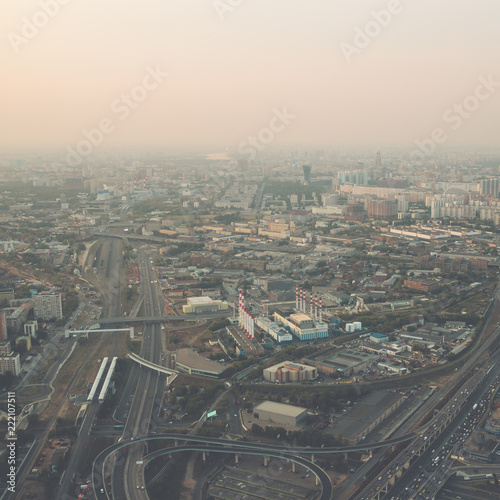 Aerial top view of Moscow city from above  roads with car traffic  cityscape panorama  buildings in evening dusk