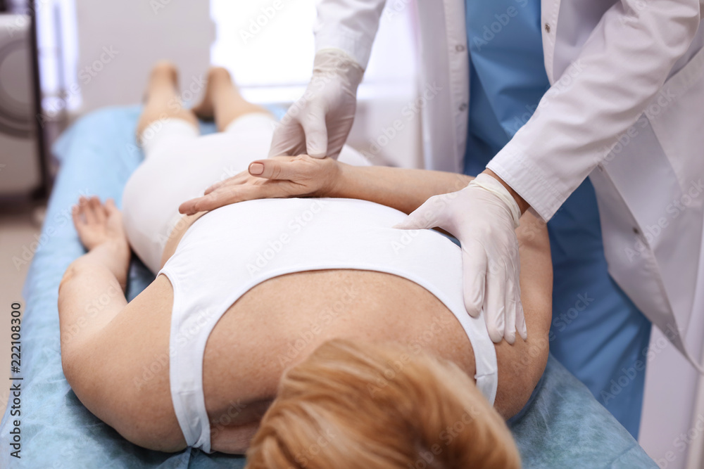 Orthopedist examining patient in hospital Orthopedist examining patient in hospital
