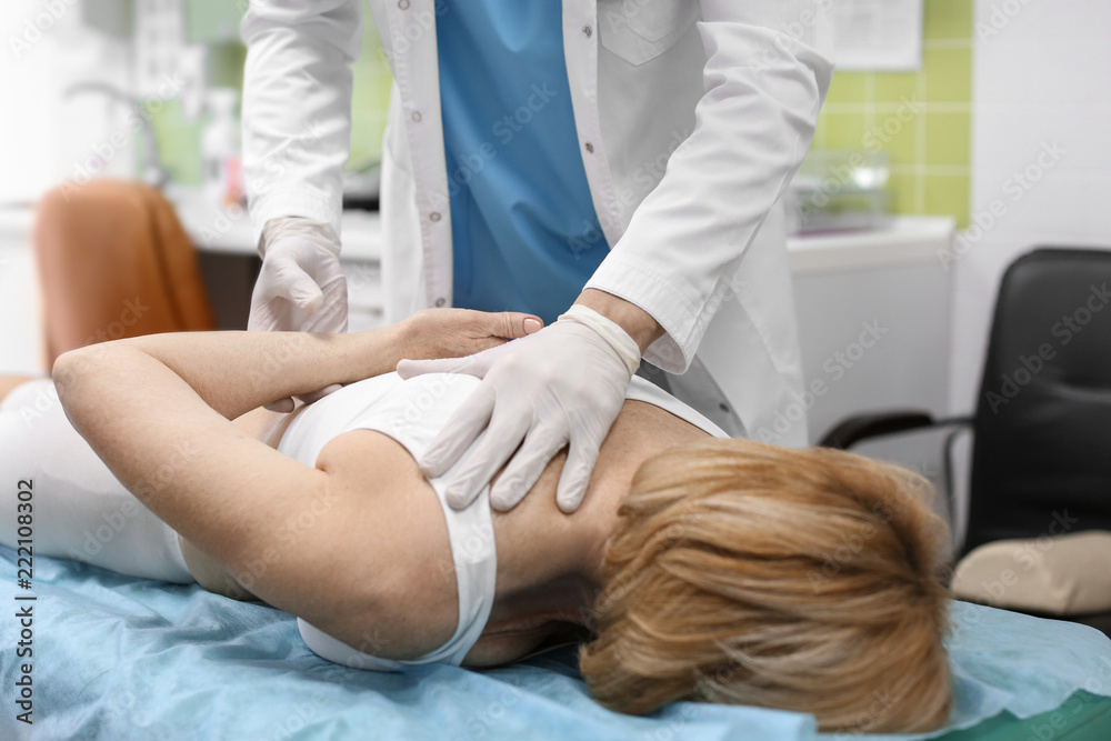 Orthopedist examining patient in hospital Orthopedist examining patient in hospital