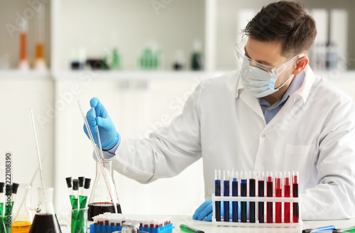 Scientist in a lab coat, fa...