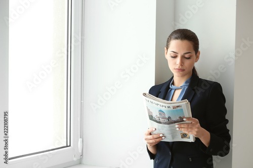 Young businesswoman reading...