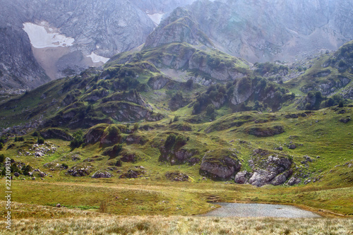 Natural landscape photo of Small wonderful mountain lake Psenodah in North Caucasus near Fisht and Oshten mountains