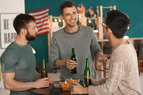 Men drinking beer in bar