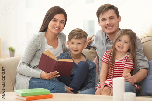 Happy family reading book t...