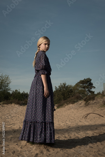 Girl in blue dress photo