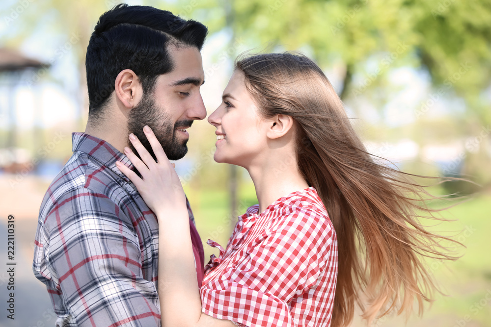 Happy young couple in park on spring day