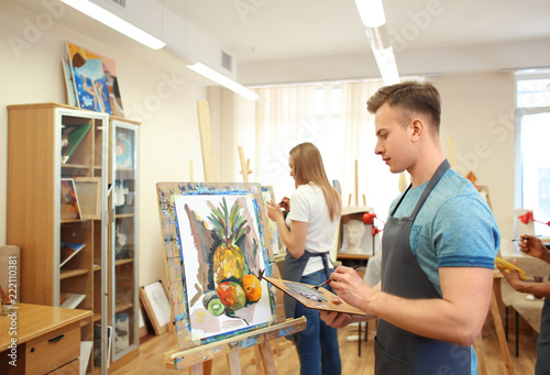 Art students painting in workshop