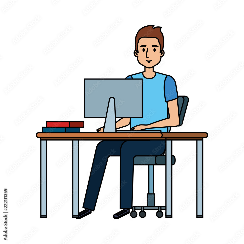 young man at desk with computer young man at desk with computer