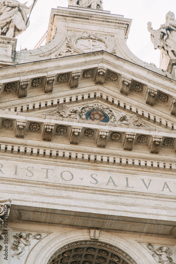 Salvatore Church in Rome, view from outside and inside. Frescoes and statues, architectural elements. A historic landmark, tourist destination. Ancient painting