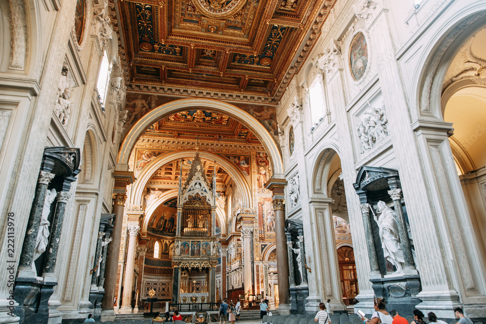 Salvatore Church in Rome, view from outside and inside. Frescoes and statues, architectural elements. A historic landmark, tourist destination. Ancient painting