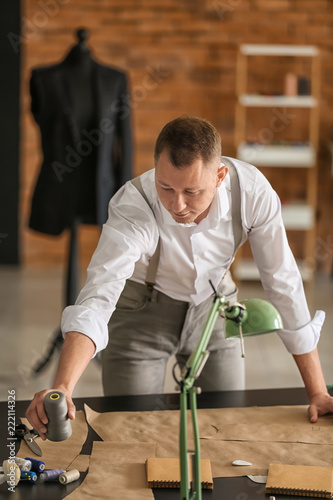Young tailor working with s...