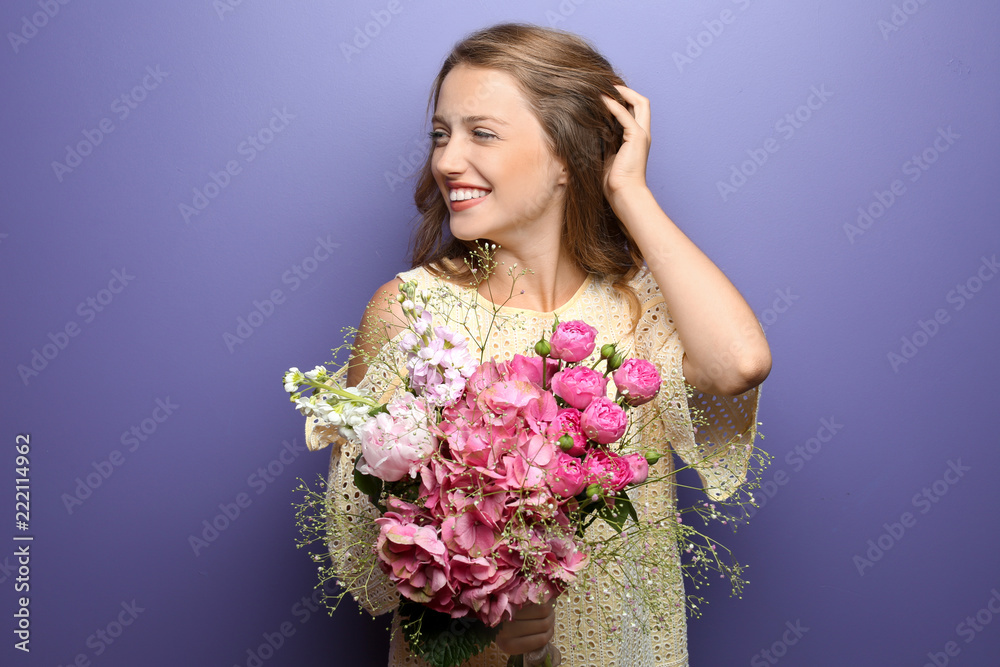 Young woman with beautiful flowers on color background Young woman with beautiful flowers on color background