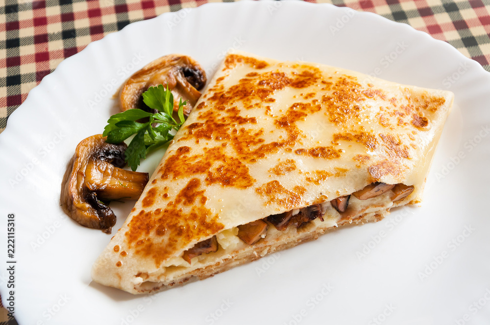 hot tasty pancake with potatoes and mushrooms hot tasty pancake with potatoes and mushrooms
