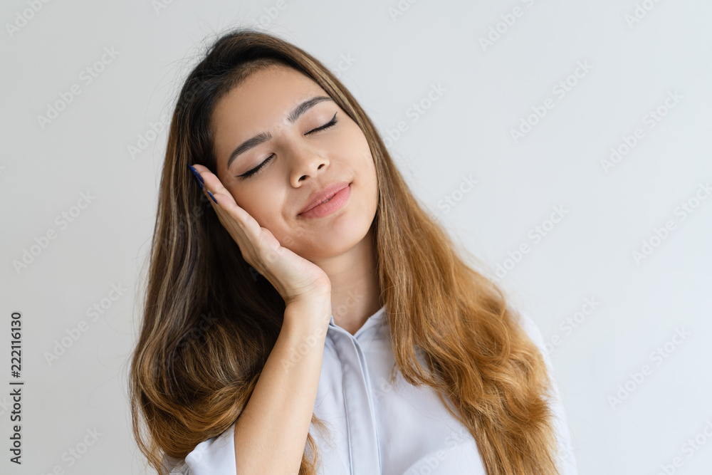 Serene pretty woman making sleep gesture with her eyes closed. Beautiful lady. Sleep concept. Isolated front view on white background. Serene pretty woman making sleep gesture with her eyes closed. Beautiful lady. Sleep concept. Isolated front view on white background.