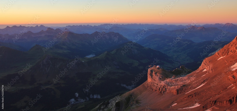 Sunset view from Glacier 3000, Switzerland. Lake Arnen and Saanenland Valley.