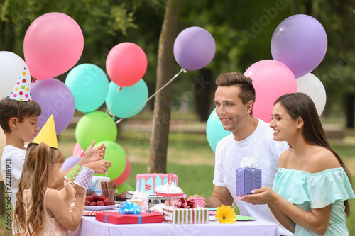 Happy family celebrating bi...