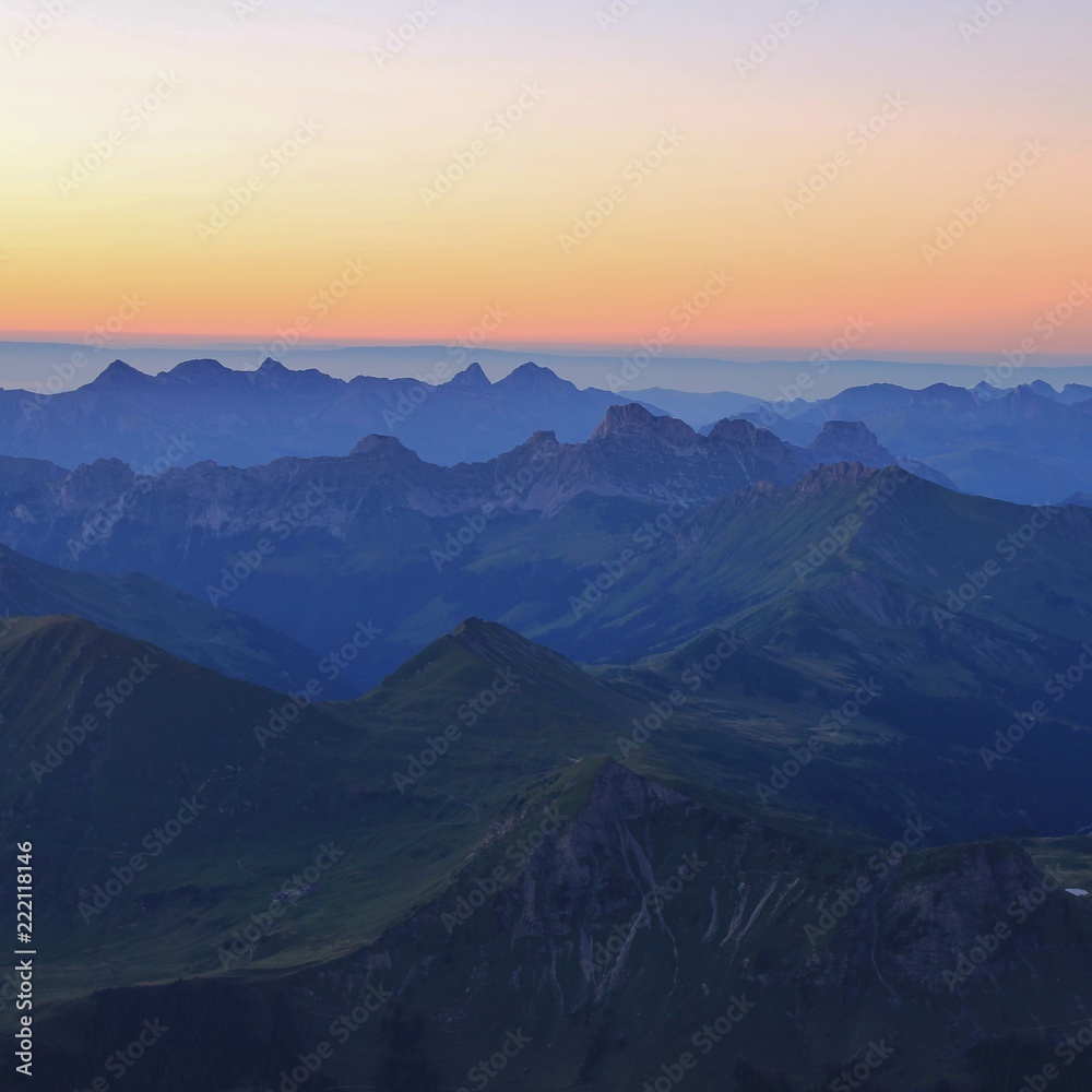 Mountain ranges in Vaud Canton at sunset. View from Glacier 3000, Switzerland.