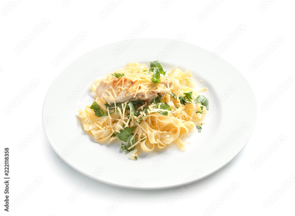 Plate of delicious pasta with chicken fillet and cheese on white background