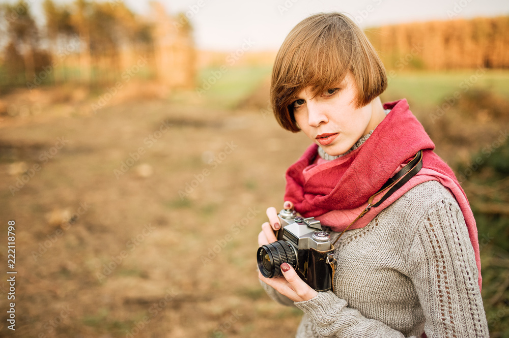 young beautiful brunette girl with a beautiful face and figure, hipster, retro posing with a camera outdoors, taking pictures, woman, photographer, vintage camera, outdoor portrait young beautiful brunette girl with a beautiful face and figure, hipster, retro posing with a camera outdoors, taking pictures, woman, photographer, vintage camera, outdoor portrait