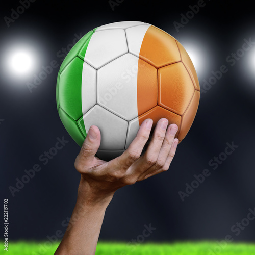 Man holding Soccer ball with Irish flag