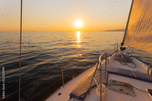 Sailing ship luxury yacht boat in the Sea during amazing sunset
