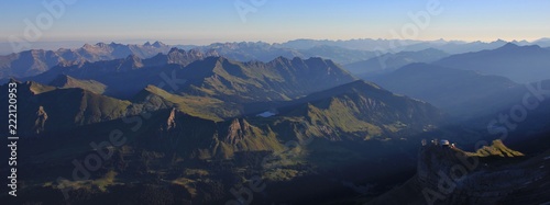 Sunrise view from Glacier 3000, Switzerland. Mountain ranges and Lake Arnen. photo