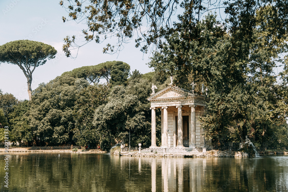 Sculptures in the parks of Rome, nature and architecture. Ancient monuments of culture. Arches and columns, fountain and lake. Flowering plant Sculptures in the parks of Rome, nature and architecture. Ancient monuments of culture. Arches and columns, fountain and lake. Flowering plant