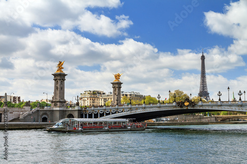 Beautiful spring view of the pont Alexandre III over the river Seine with the Eiffel tower in the background in Paris, France 