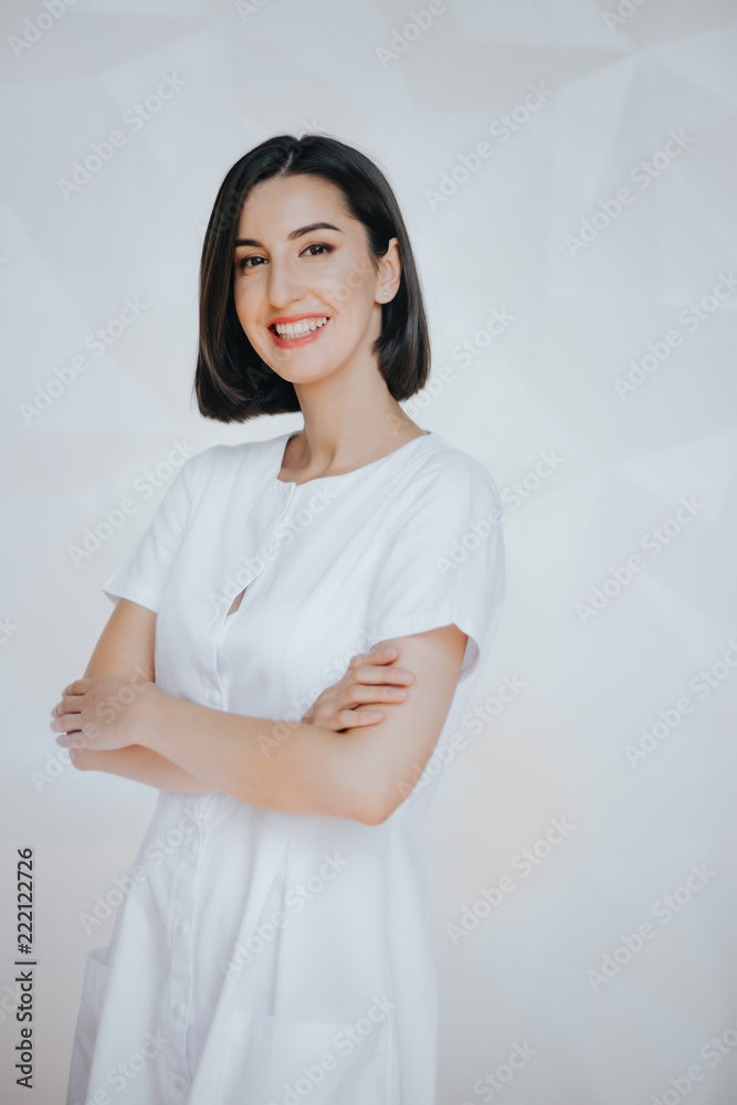 Smiling confident beautician posing in clinic of esthetic medicine.Smiling confident beautician posing in clinic of esthetic medicine Smiling confident beautician posing in clinic of esthetic medicine.Smiling confident beautician posing in clinic of esthetic medicine