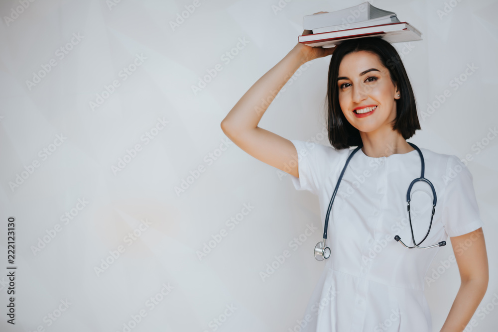 Portrait of a woman doctor. Beautician. Dermatologist. Skin care.Smiling confident beautician posing in clinic of esthetic medicine. Aesthetics. Beauty. Medicine. Plastic surgeon. Portrait of a woman doctor. Beautician. Dermatologist. Skin care.Smiling confident beautician posing in clinic of esthetic medicine. Aesthetics. Beauty. Medicine. Plastic surgeon.