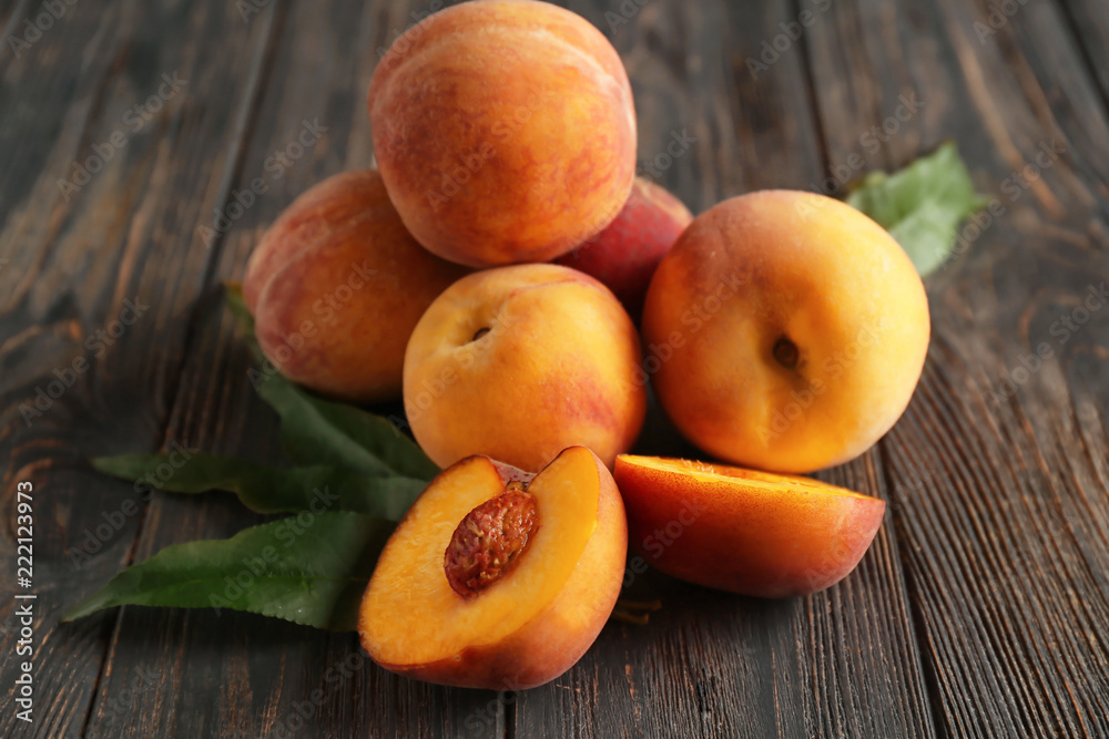 Fresh peaches on wooden table