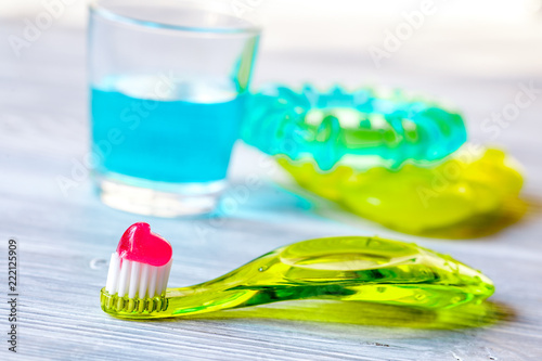 children s toothbrush oral care on wooden background