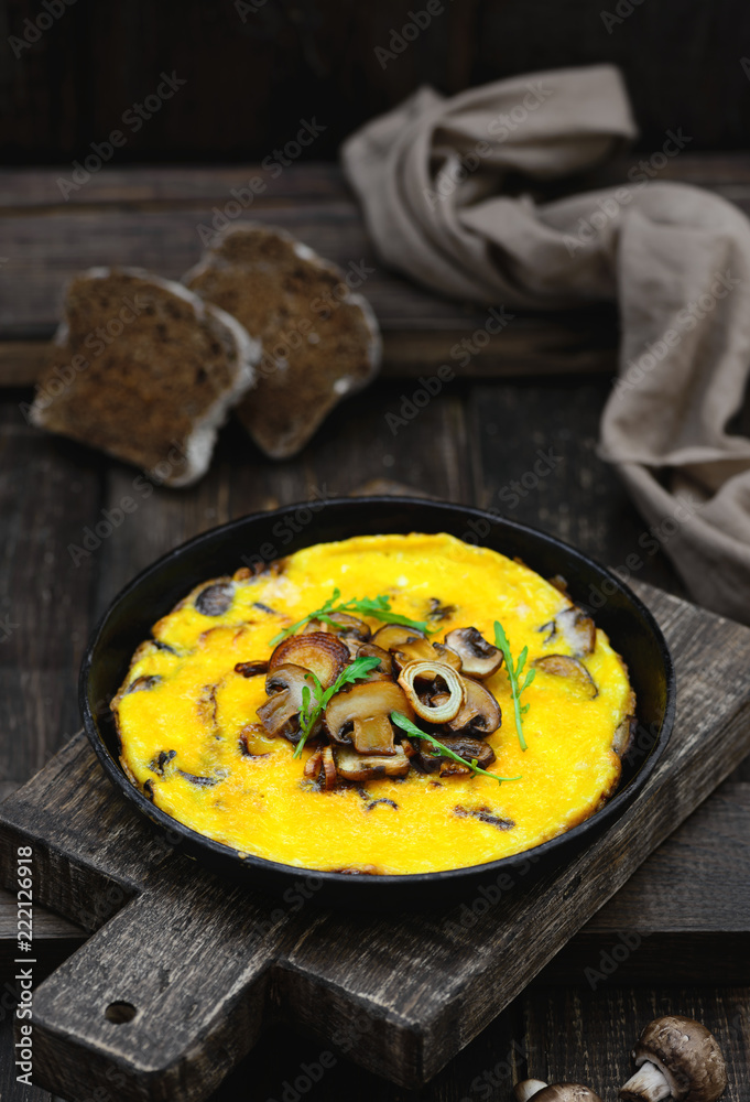 Omelette with mushrooms in a frying pan Omelette with mushrooms in a frying pan