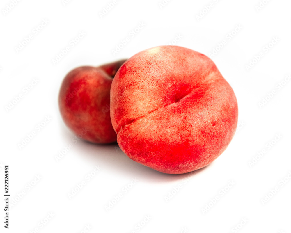 Saturn Peach isolated on white background. Flat peaches, two doughnut peaches in a pile. Saturn Peach isolated on white background. Flat peaches, two doughnut peaches in a pile.
