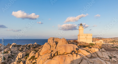 Lighthouse on granite rock formations at Capo Testa, Sardinia, Italy in sunset.